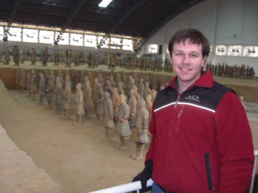 Me standing in front of reconstructed terra-cotta warriors taken from pit 1.